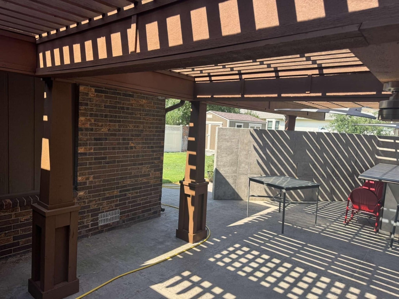 Backyard pergola after staining