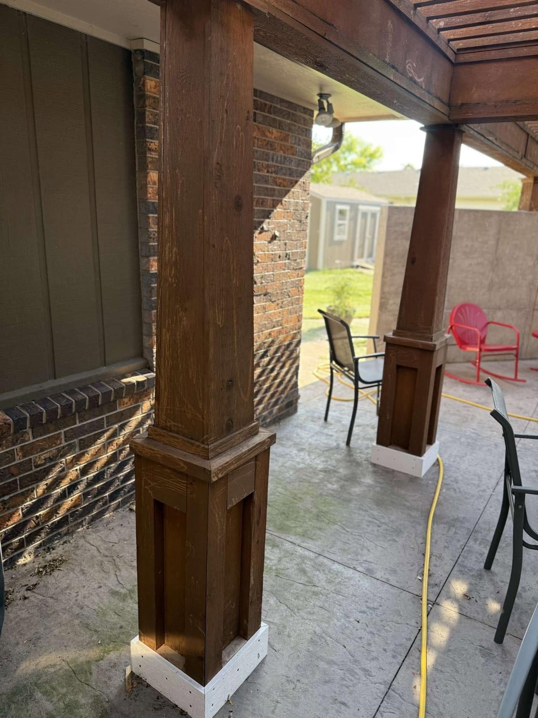 Pergola posts before staining, gray weathered wood